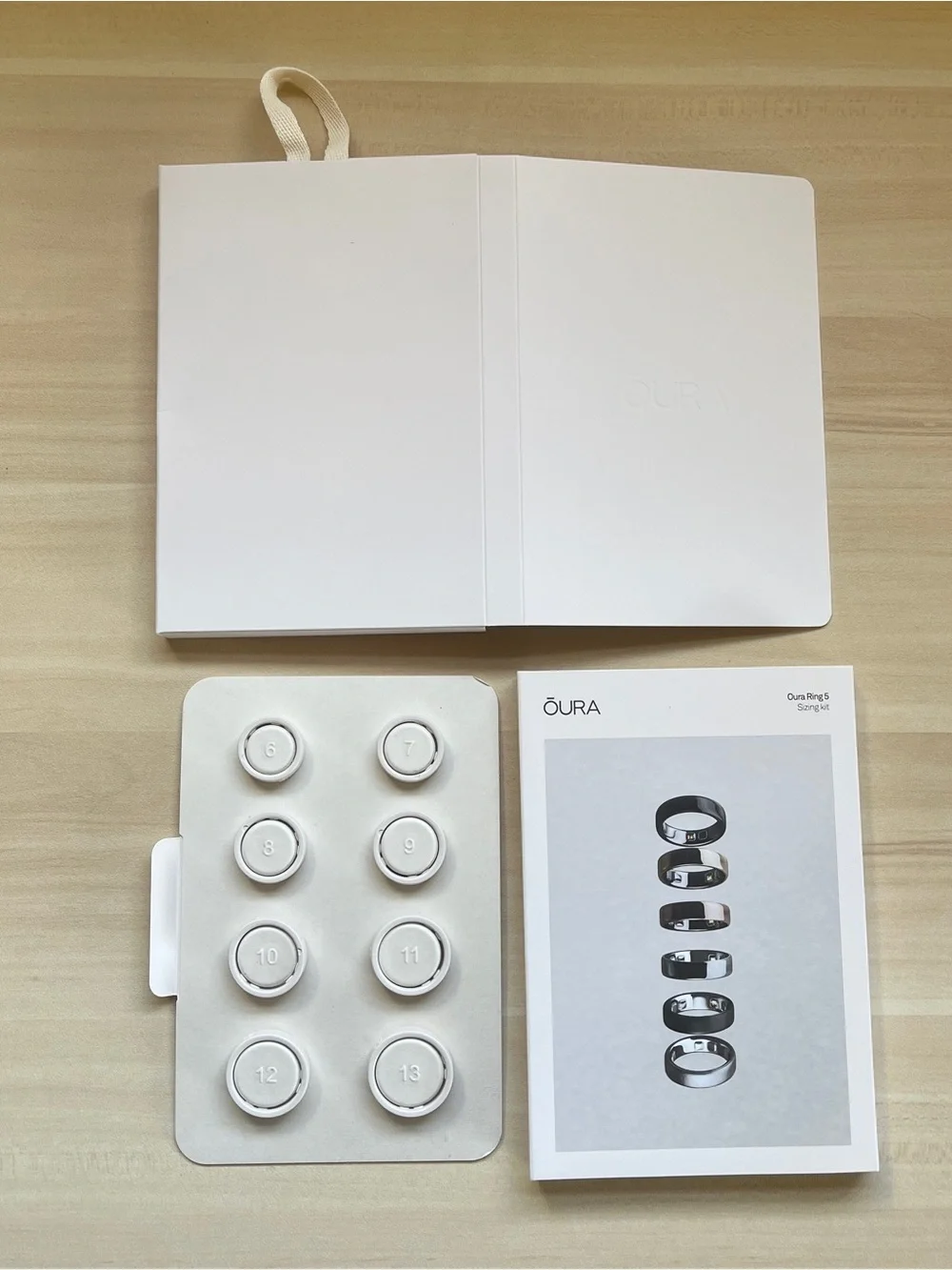 Oura Sizing Kit Packaging — White with Black Text
